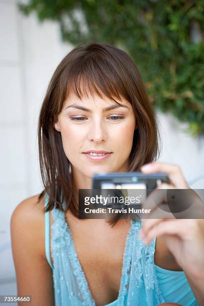 woman taking a photograph - hands in the air heart stock-fotos und bilder
