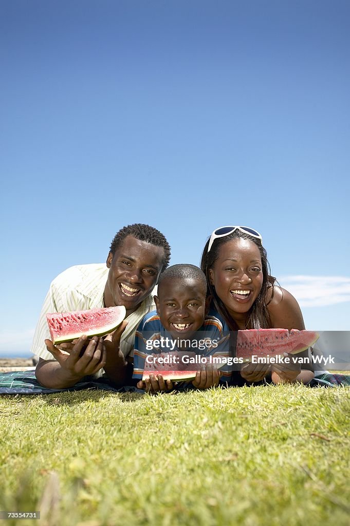 African Family Eating Watermelon