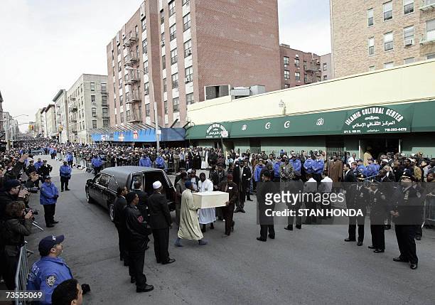 New York, UNITED STATES: A coffin of one of the victims is carried into the Islamic Cultural Center, 12 March 2007, in the Bronx borough of New York...