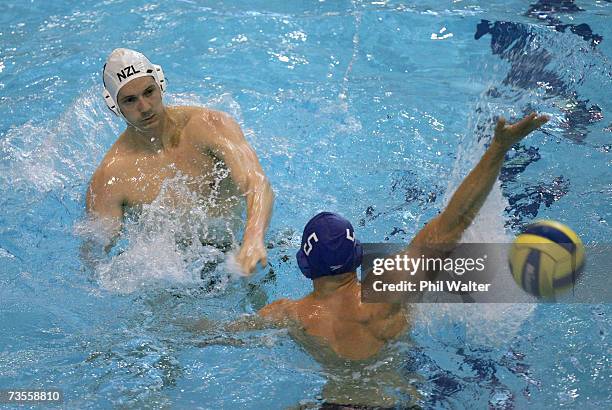 Timothy Grace of New Zealand makes a shot at goal through Craig Figes of Great Britain during the Southern Cross International Water Polo Cup match...