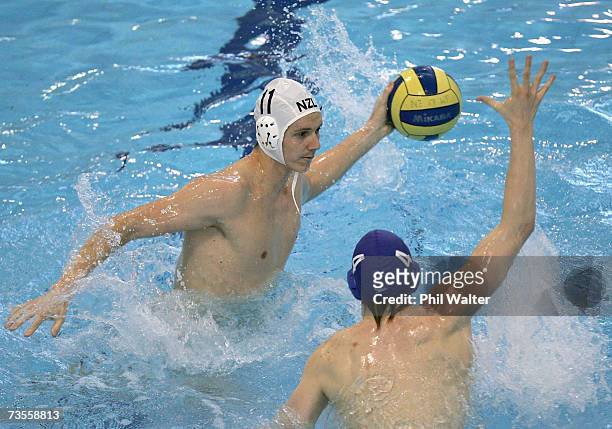 Timothy Grace of New Zealand looks to pass the ball around Scott Carpenter of Great Britain during the Southern Cross International Water Polo Cup...