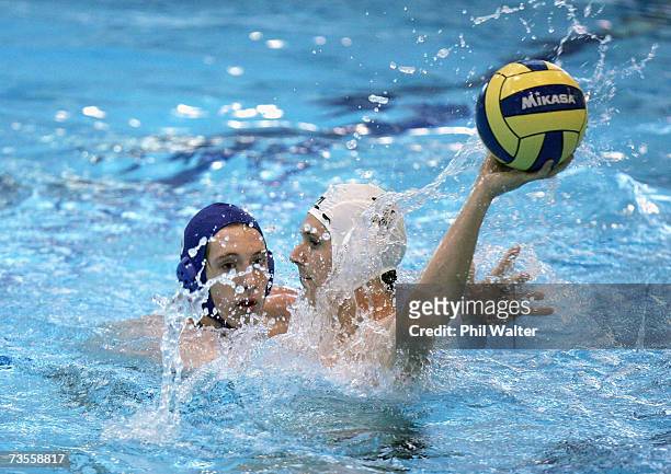 Timothy Grace of New Zealand passes the ball under pressure from Tom Curwen of Great Britain during the Southern Cross International Water Polo Cup...