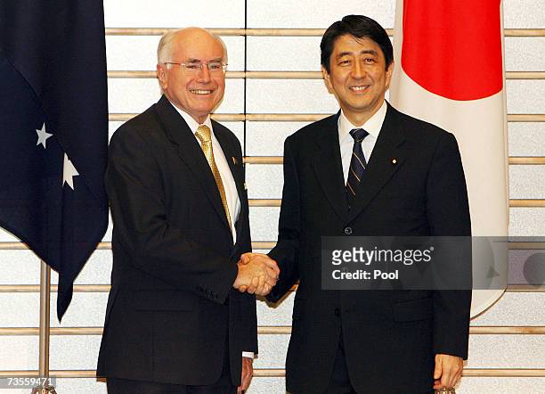 Visiting Australian Prime Minister John Howard is welcomed by Japanese Prime Minister Shinzo Abe prior to talks at the Abe's official residence on 13...