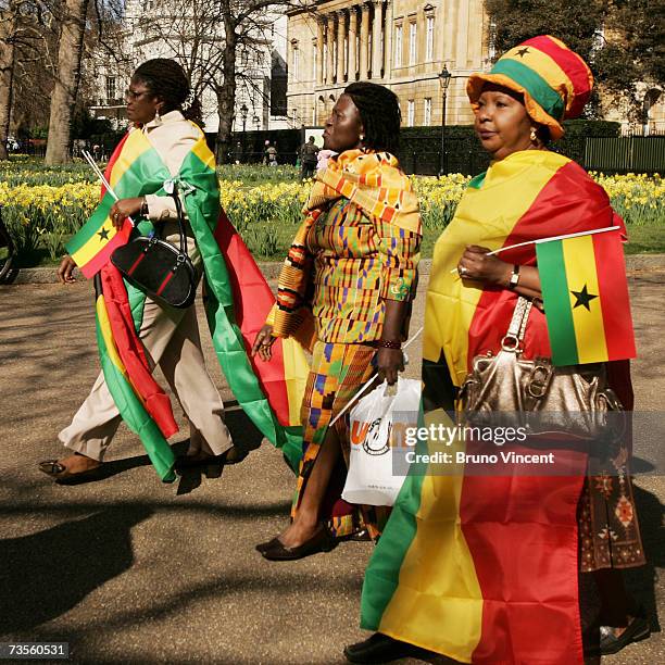 Supporters of President of Ghana John Kufuor walk along The Mall on March 13, 2007 in London, England. The President will attend a State Banquet with...