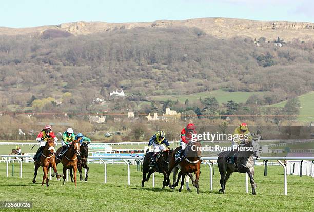 Horses approach the last hurdle during The Anglo Irish Bank Supreme Novices Hurdle Race on the first day of The Annual National Hunt Festival held at...