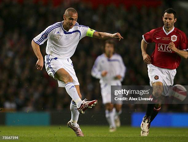 Henrik Larsson of a Europe XI shoots at goal during the UEFA Celebration match between Manchester United and Europe XI at Old Trafford on March 13,...