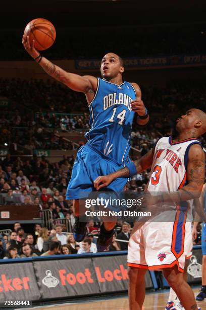Jameer Nelson of the Orlando Magic shoots a against Stephon Marbury of the New York Knicks during a game at Madison Square Garden on February 20,...
