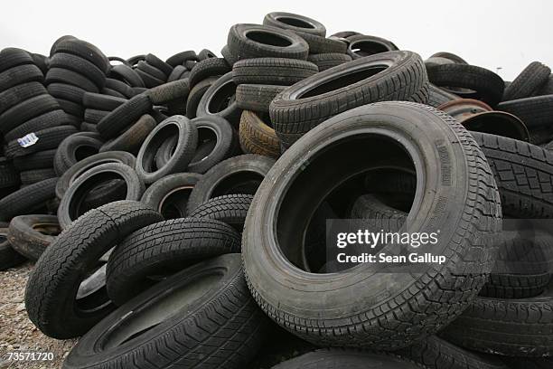Discarded car tires lie at a depot for wrecked and abandoned cars March 9, 2007 in Schopsdorf, Germany. The disposal of used tires is an...