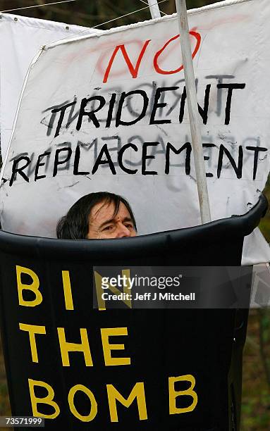 Campaigners protest at the Faslane naval base on the Clyde, home of the Trident Submarine fleet, March 14, 2007 in Faslane, Scotland. MPs will take a...