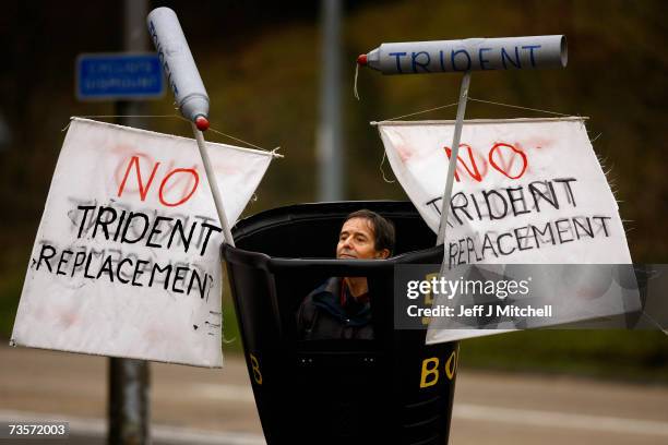 Campaigners protest at the Faslane naval base on the Clyde, home of the Trident Submarine fleet, March 14, 2007 in Faslane, Scotland. MPs will take a...