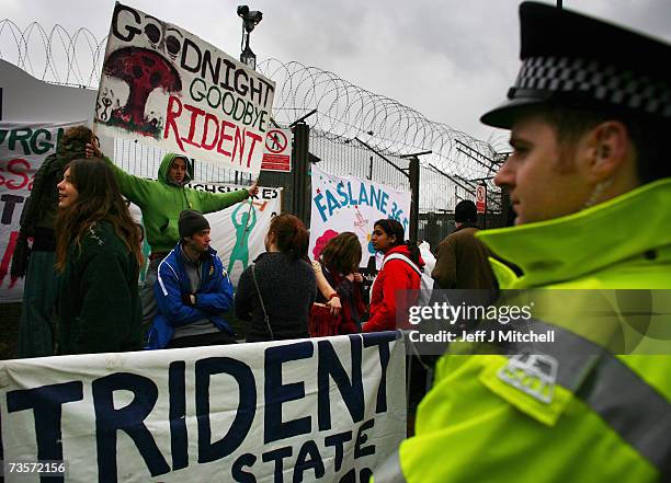 Campaigners protest at the Faslane naval base on the Clyde, home of the Trident Submarine fleet, March 14, 2007 in Faslane, Scotland. MPs will take a...