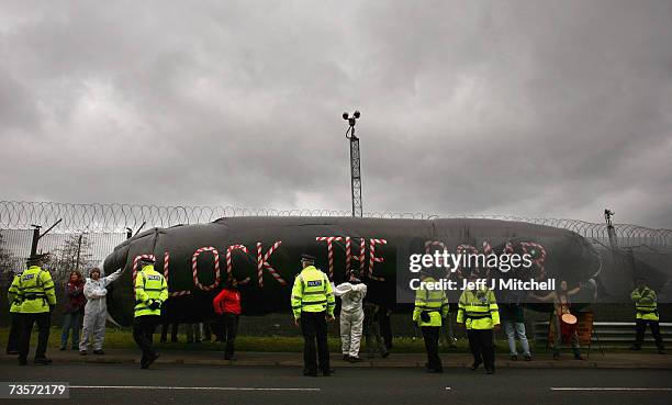 Campaigners protest at the Faslane naval base on the Clyde, home of the Trident Submarine fleet, March 14, 2007 in Faslane, Scotland. MPs will take a...