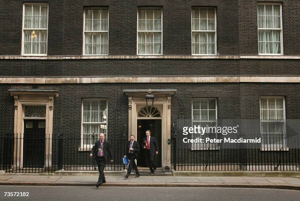 Prime Minister Tony Blair walks to his car with Keith Hill MP and a protection officer in Downing Street on March 14, 2007 in London. The government...