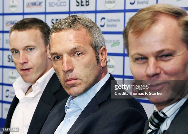 Assistant coach Frank Geideck, head coach Ernst Middendorp and financial director Roland Kentsch look on during the press conference to announce the...