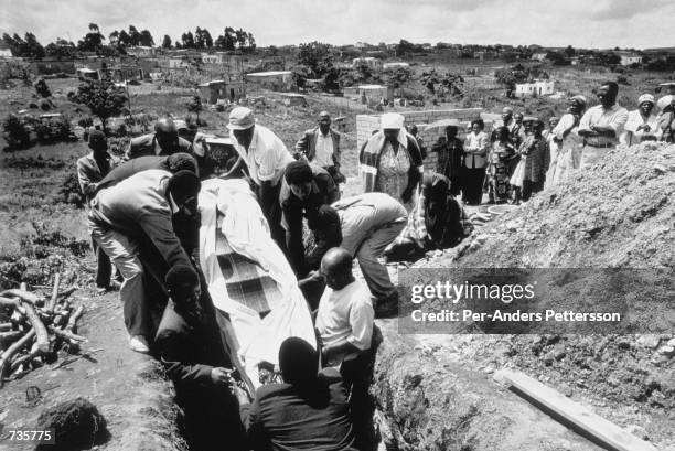 Woman who died of an Aids related disease is buried September 13, 1999 in her garden in Gamalakhe, South Africa. South Africa has the highest rate of...
