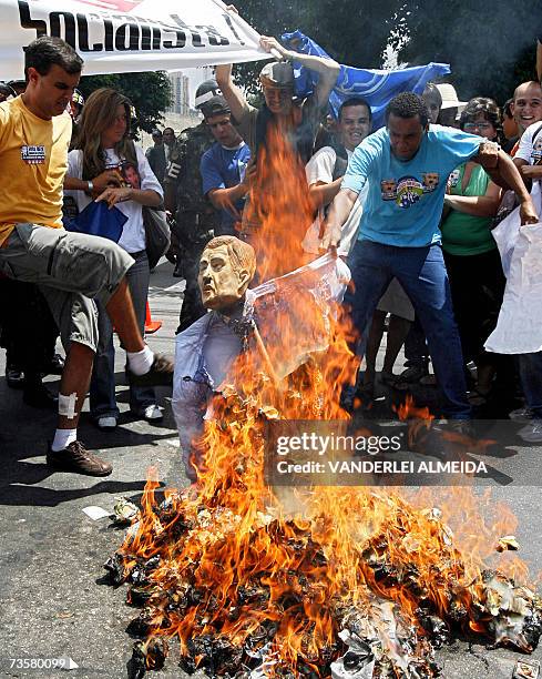 Protesters burn a dummy which represents US President George W. Bush near the Hilton Hotel in Sao Paulo, 09 March 2007. Bush left Thursday for a tour...
