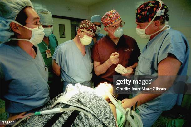 Rotaplast plastic surgeons, foreground left to right: Dr. Sumira , Dr. Garcia Delano , Dr. Capozzi and Dr. Di Francesco Eklund confer about surgical...