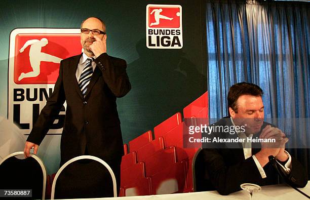 The new president of the German Football League Wolfgang Holzhaeuser and member of the board Heribert Bruchhagen gesticulate during the German...