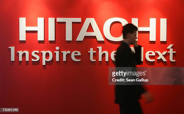 Visitor walks by the Hitachi stand at the CeBIT technology fair March 15, 2007 in Hanover, Germany. CeBIT, the world's largest tech fair, will run...