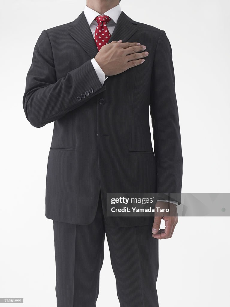 Businessman taking oath, mid section