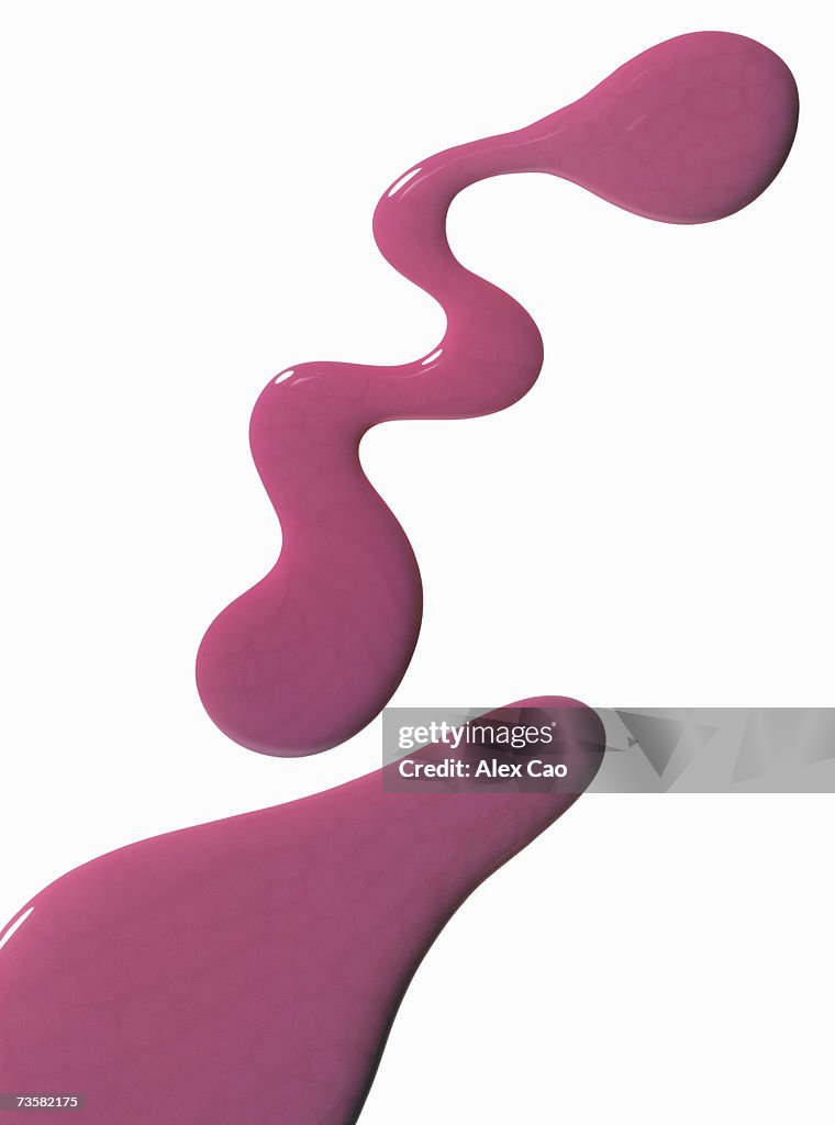 Smears of pink nail polish on white background