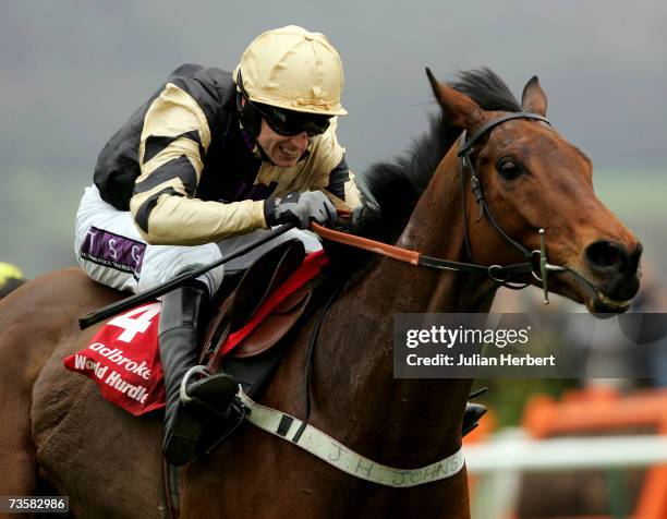 Paddy Brennan and Inglis Drever (pull away from the last flight to land The Ladbrokes World Hurdle Race on the third day of The Annual National Hunt...