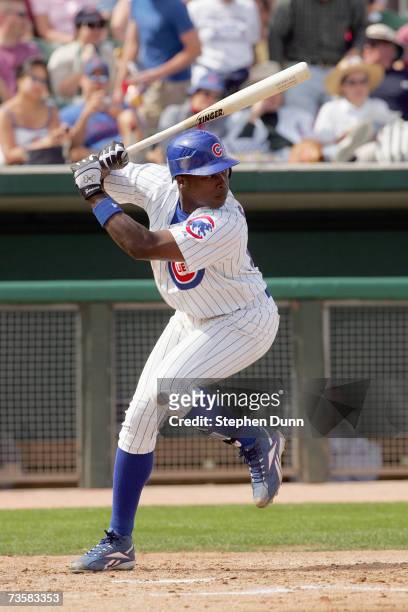 Alfonso Soriano of the Chicago Cubs gets a single for his third hit of the game against the Chicago White Sox during Spring Training at Hohokam Park...