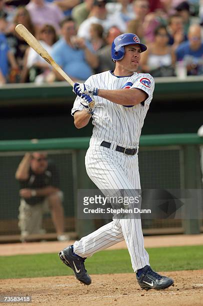 Micah Hoffpauir of the Chicago White Sox swings at the pitch against the Chicago Cubs during Spring Training at Hohokam Park March 4, 2007 in Mesa,...