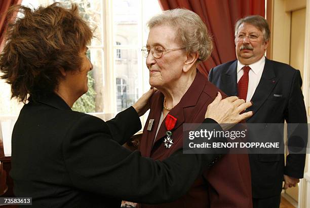 French ambassador to Belgium Joelle Bourgois gives the French national order of Legion of honour to Gilberte Tilly one of five Belgian resistants of...