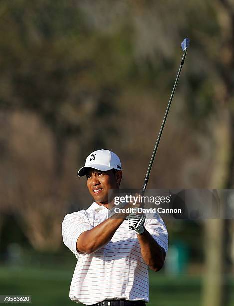 Tiger Woods of the USA plays his second shot at the par 4, 10th hole during the first round of the Arnold Palmer Invitational presented by...