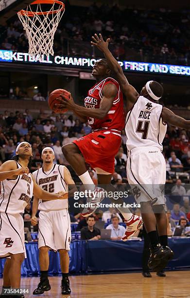 Martin Zeno of the Texas Tech Red Raiders goes up for a shot in front of Tyrese Rice of the Boston College Eagles in the second half of the First...