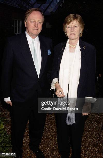 Andrew Parker Bowles and his wife Rosemary Pitman attend the Cartier Gala Evening at the Chelsea Physic Garden May 20, 2003 in London, England.