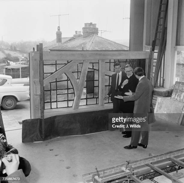 Archbishop of Liverpool George Beck visits the studio of stained-glass artist Patrick Reyntiens in Loudwater, Buckinghamshire, to view the stained...