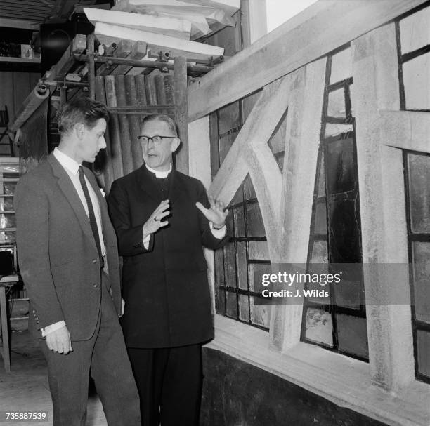 Archbishop of Liverpool George Beck visits the studio of stained-glass artist Patrick Reyntiens in Loudwater, Buckinghamshire, to view the stained...