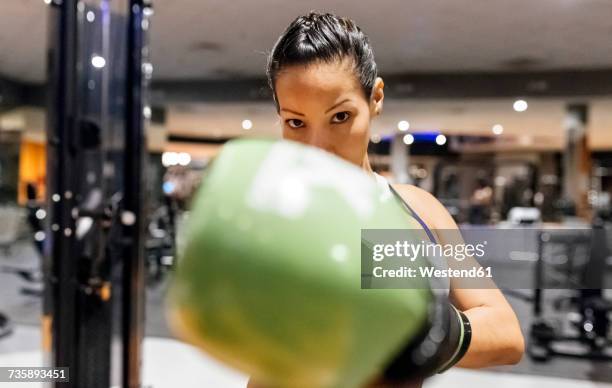 woman practicing boxing in the gym - boxing glove stock pictures, royalty-free photos & images