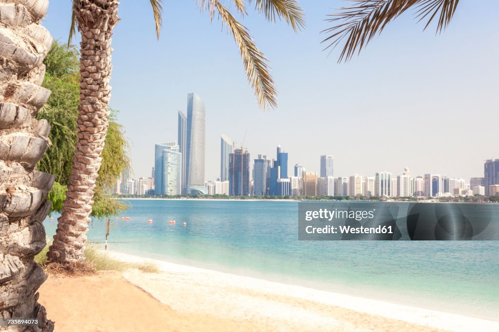 UAE, Abu Dhabi, palm, beach and skyline