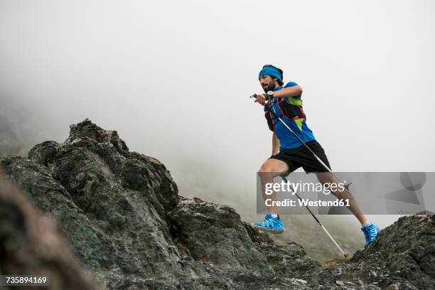 italy, alagna, trail runner on the move near monte rosa mountain massif - trailrunning stock-fotos und bilder