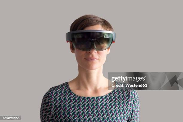 woman wearing mixed reality smartglasses - mixed reality ストックフォトと画像