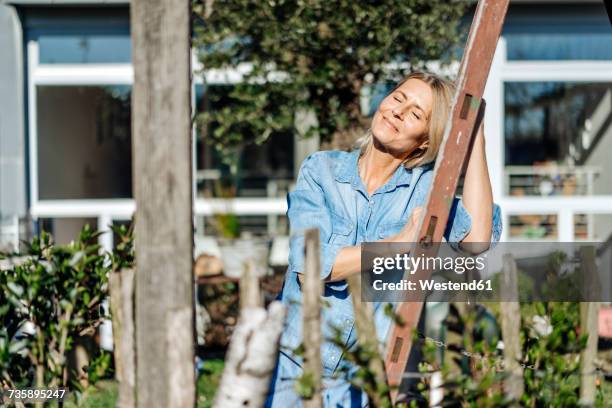woman relaxing in garden - sunbathing stock pictures, royalty-free photos & images