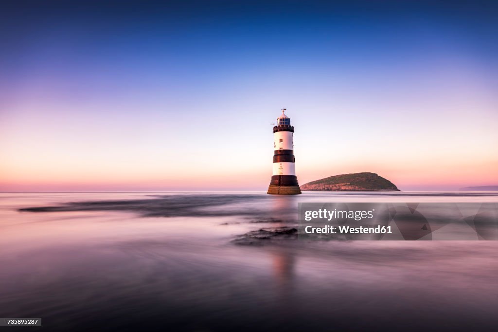UK, Wales, Anglesey, Penmon, Dinmor Point, Trywn Du Lighthouse with Puffin Island in the background