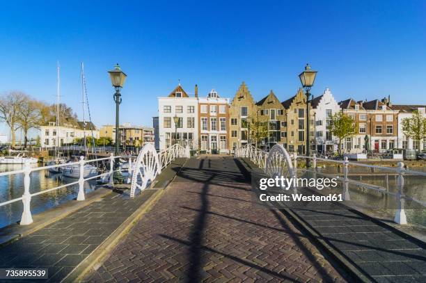 netherlands, zeeland, middelburg, bridge and city harbour - middelburg netherlands stock-fotos und bilder