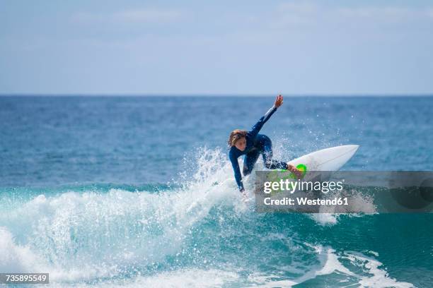 boy surfing in the sea - surf imagens e fotografias de stock