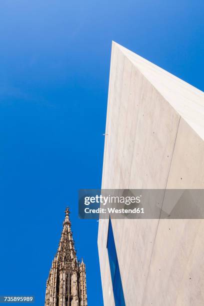 germany, ulm, ulmer minster church and facade of modern office building - ulmer münster stock-fotos und bilder