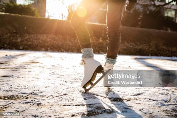 close-up of woman ice skating on canal - hockey skate stock pictures, royalty-free photos & images