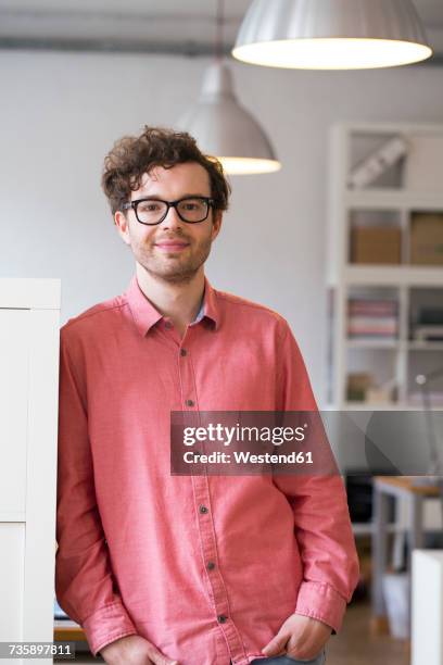 portrait of confident man standing in office - pink collared shirt stock pictures, royalty-free photos & images