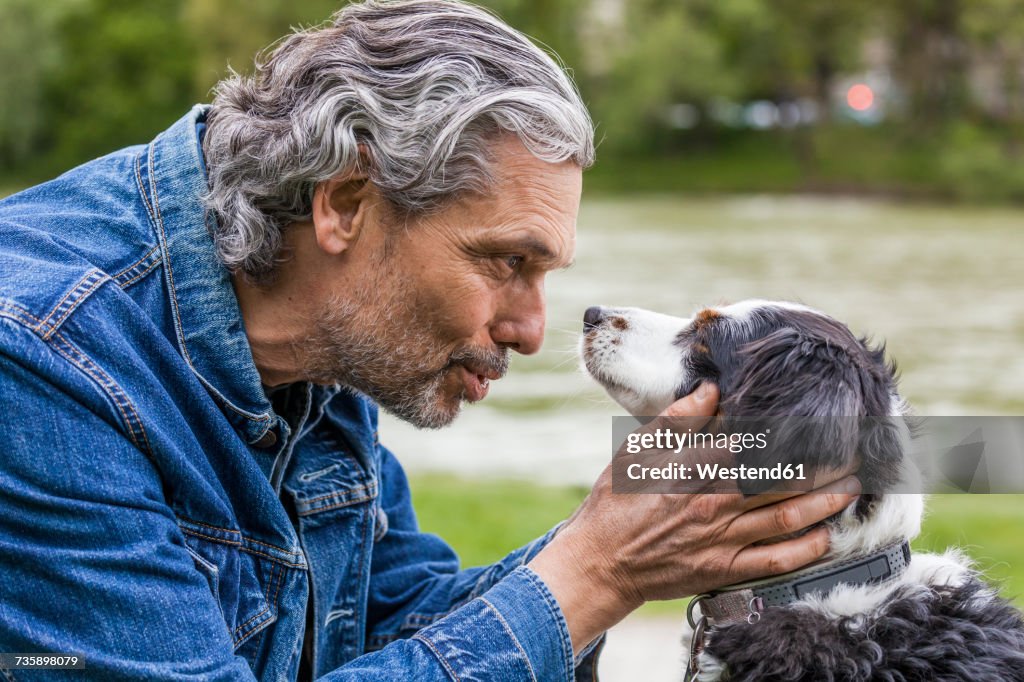 Senior man talking to his dog