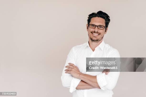 portrait of smiling businessman - white shirt stockfoto's en -beelden