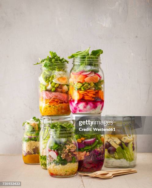 preserving jars with various salads - making lunch stock pictures, royalty-free photos & images