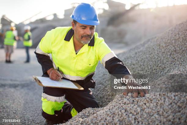 quarry worker doing a quality check - quarry work stock pictures, royalty-free photos & images