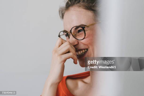 portrait of happy young woman with glasses - hand gag stock-fotos und bilder